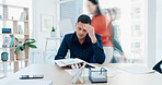 Stress, anxiety and man in busy office with headache, note or time management crisis. Mental health, chaos and business person with document, paperwork and burnout or overwhelmed at creative startup
