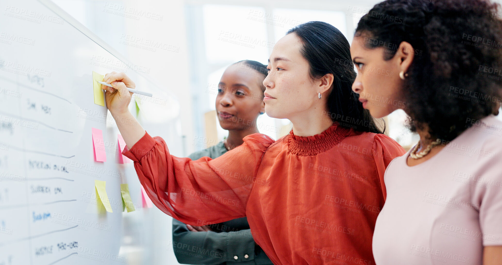 Buy stock photo Women, writing and whiteboard with sticky notes for planning, project strategy or tasks in office. Creative, female people or employees with team ideas for company schedule, agenda or brainstorming