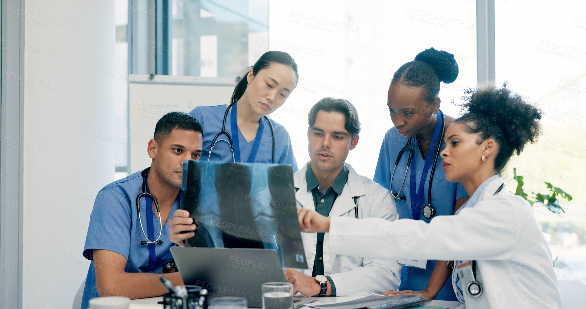 Buy stock photo Doctor, nurse and x ray in hospital with discussion, laptop or medical research for disease diagnosis. Healthcare worker, people and conversation with bones scan, teamwork or advice for test results.
