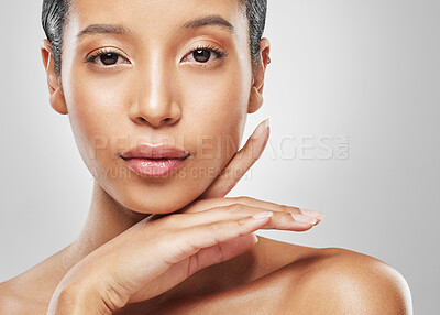 Buy stock photo Portrait, skincare and woman in studio with natural cosmetics, glow and health on white background. Serious, dermatology and person with self care for skin wellness, confidence or shine with beauty