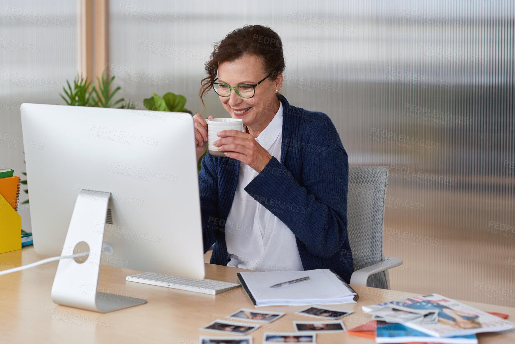 Buy stock photo Coffee, computer and business woman with pictures for profile, portfolio and info at modeling agency. Creative, office and person with drink and photos for talent scout, casting director and website