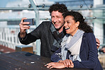 Happy couple taking photo using smartphone in watefront sharing vacation photographing holiday memories with mobile phone camera