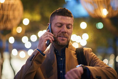 Buy stock photo Man, night and watch with phone call in city for schedule, reminder or checking time. Mature, male person or travel with wristwatch or smartphone for conversation or commute with bokeh in urban town