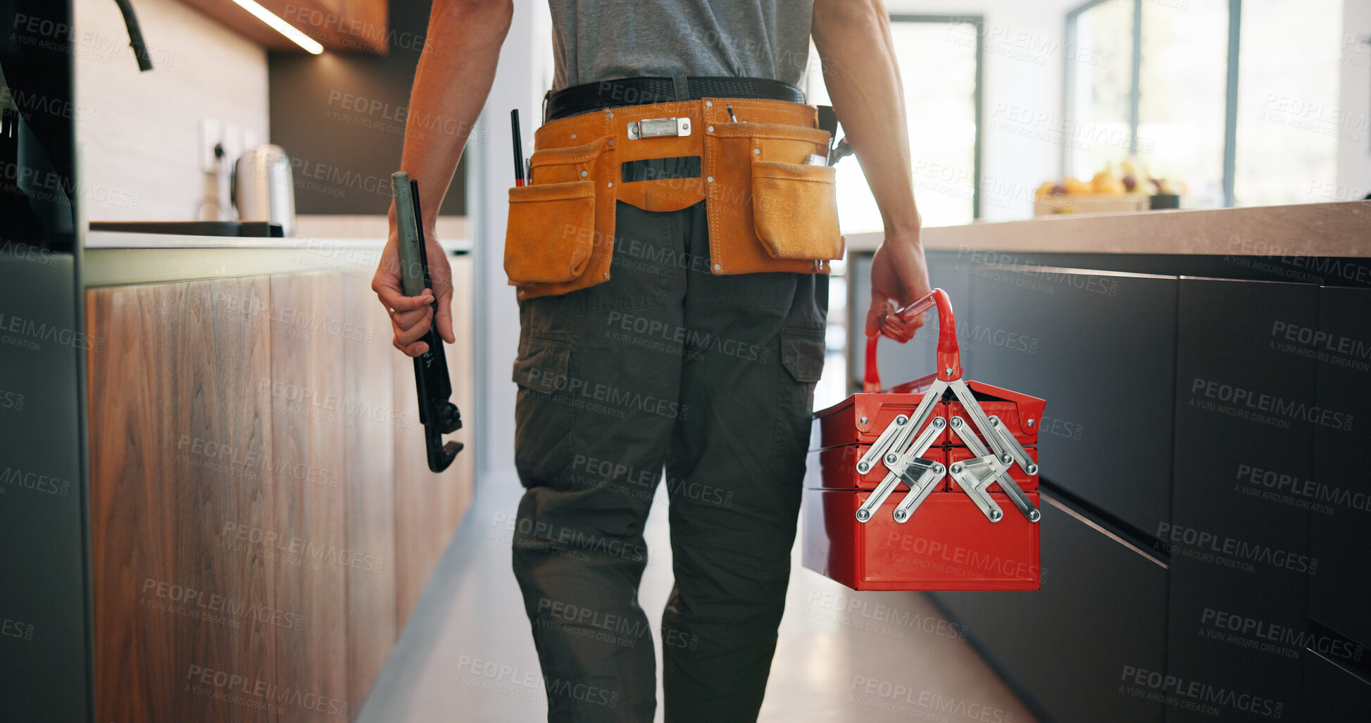Buy stock photo Plumber, man and hands in kitchen with toolbox, maintenance job or repair skills for renovation project. Handyman, person and technician walk in home with diy equipment, plumbing service and back.