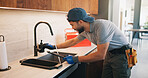 Repair, check or plumber in kitchen with tools, tap testing or sewer review in system maintenance. Inspection, servicing or handyman with water, faucet installation or restoration in home improvement