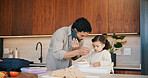 Phone call, father and feeding child in kitchen, multitask and communication for nutrition in morning. Mobile chat, dad and toddler eating breakfast at home, health and growth with single parent