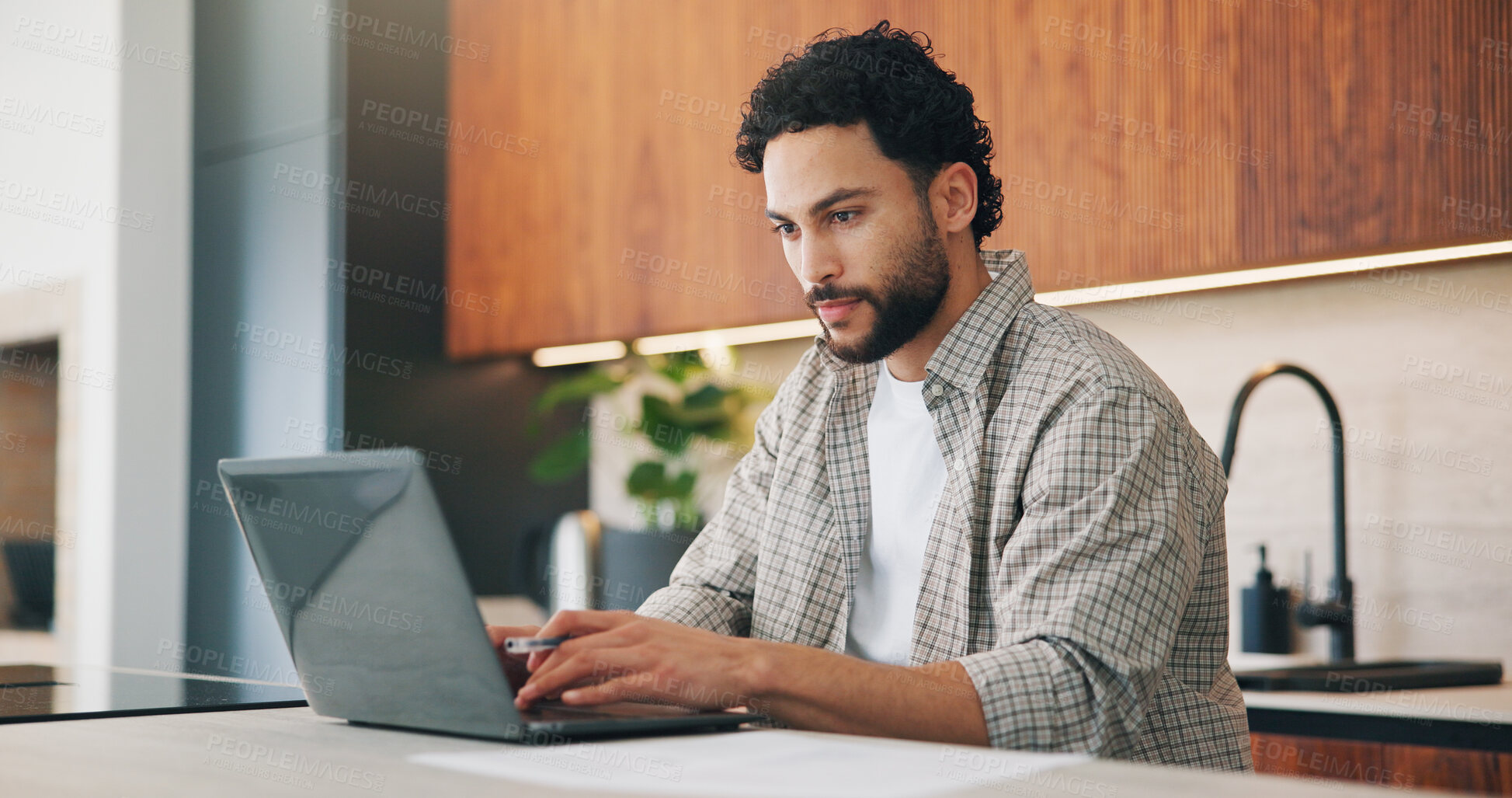 Buy stock photo Remote work, review or man in house with laptop, proofreading or novel editing in kitchen. Reading, wfh or author with tech, typing manuscript or literature chapter planning in story development.