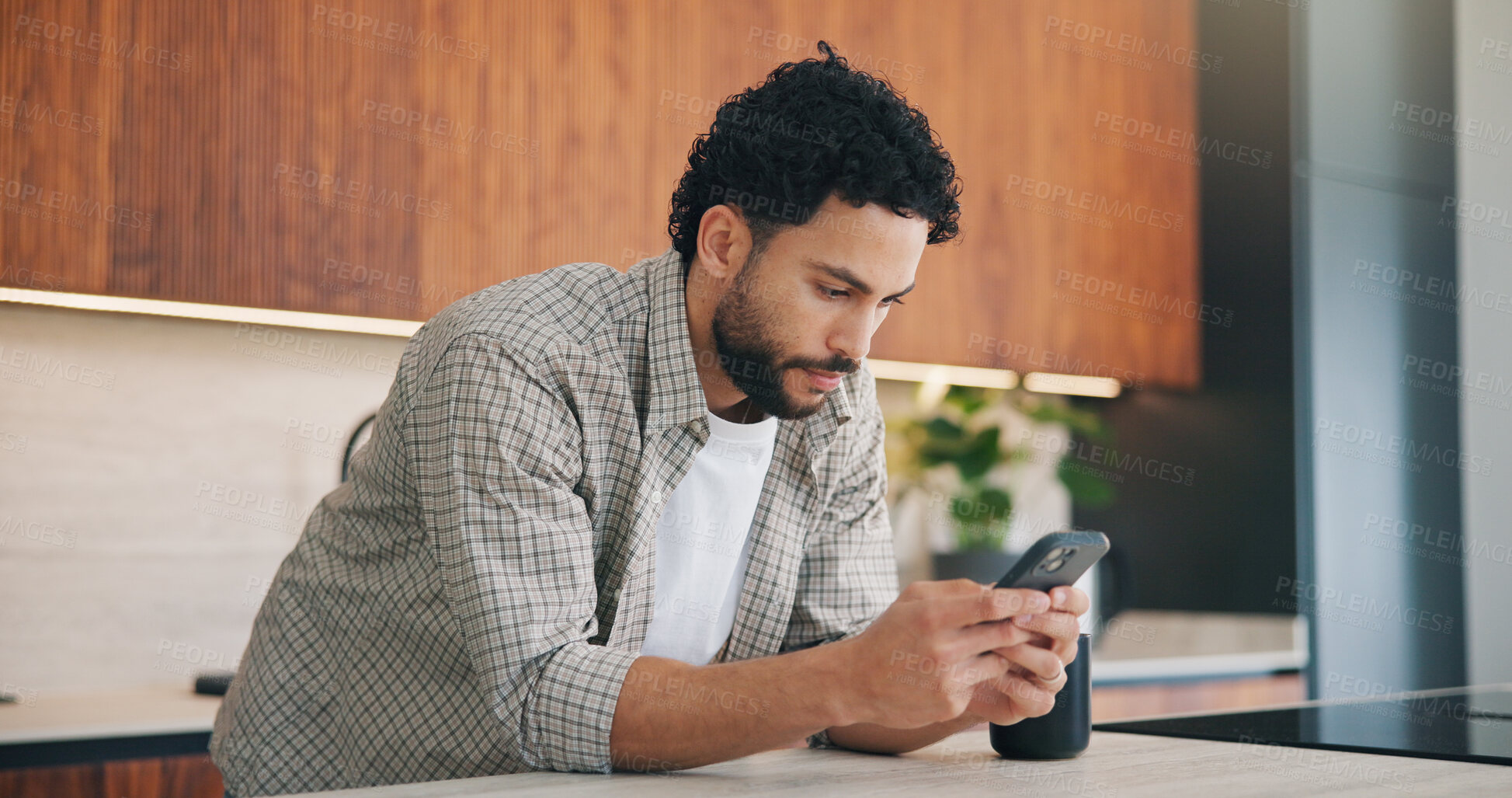 Buy stock photo Phone, online and man in kitchen for reading message, blog or browsing social media in home. Mobile, review and person in house for internet connection, texting and check forum with website post