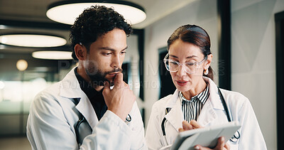 Buy stock photo Medical, tablet and team of doctors thinking for advice, problem solving or healthcare solution. Hospital, tech and people with planning, digital results or decision for treatment in clinic hallway