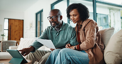 Buy stock photo Document, home and couple with tablet, insurance or pointing for tax review in living room. African man, mature woman and finance on sofa, policy paperwork or smile with tech for debt discussion