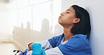 Tired, nurse and worry with woman in hospital for medical burnout, stress and thinking. Healthcare mistake, reflection and challenge with frustrated person on floor of clinic for fatigue and grief