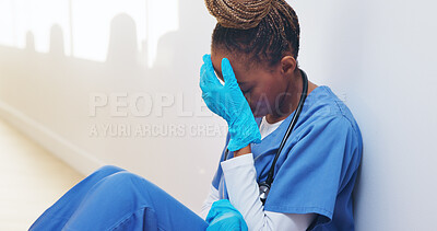 Buy stock photo Tired, nurse and stress with black woman in hospital for medical burnout, worry and thinking. Healthcare mistake, reflection and challenge with frustrated person in clinic for fatigue and grief