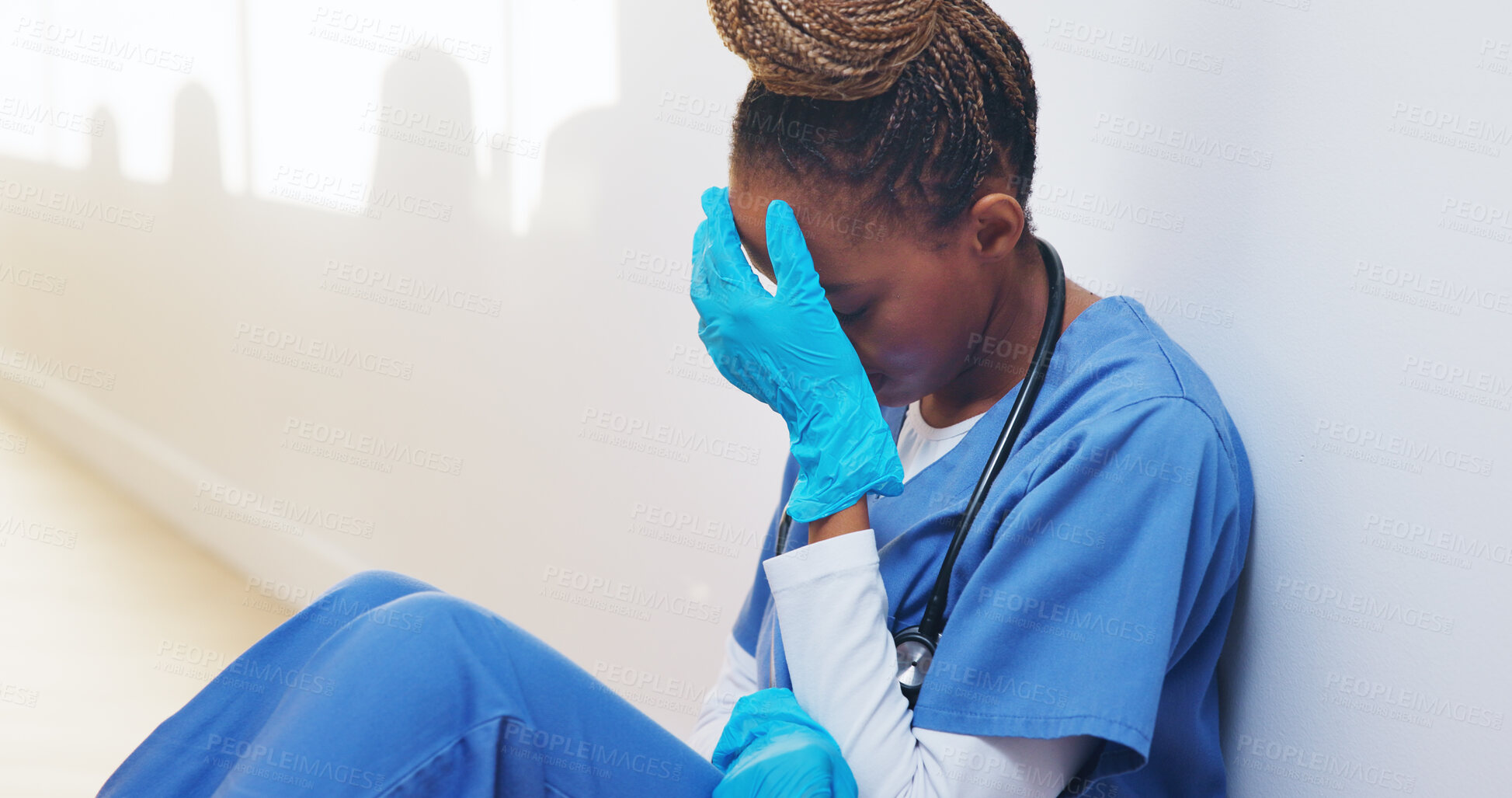 Buy stock photo Tired, nurse and stress with black woman in hospital for medical burnout, worry and thinking. Healthcare mistake, reflection and challenge with frustrated person in clinic for fatigue and grief