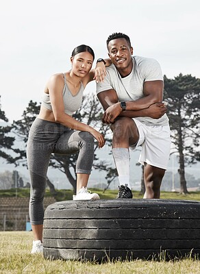 Buy stock photo Outdoor, break or couple with portrait for fitness, confidence and practice support for wellness. Resting, bonding or people with tire for exercise partner, smile or interracial relationship