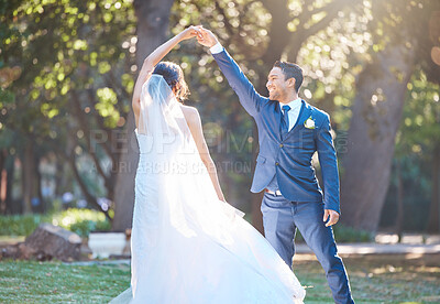Buy stock photo Happy couple, wedding and dancing at park with celebration for relationship goals in spring. People, marriage and smile with holding hands, rhythm and love with partner for milestone at garden