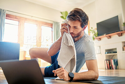 Buy stock photo Athlete, man and relax with laptop at house for fitness, online tutorial and training progress. Male person, towel and pc for research, watching video and workout instructions for wellness in lounge