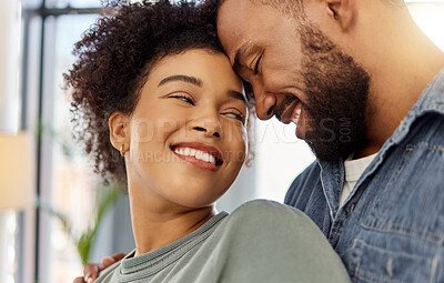 Buy stock photo Couple, forehead touch and love in home with smile for bonding, connection and trust in marriage. Embrace, affection and happy together with African people in house for commitment, support and moment