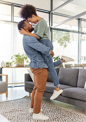 Buy stock photo Couple, lifting and love in home with happiness for bonding, connection and trust in marriage. Embrace, affection and forehead touch with African people in house for commitment, support and moment
