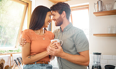 Buy stock photo Happy couple, forehead touch and drink in kitchen with care, bonding and interracial relationship. Embrace, love and man with woman in commitment, trust and loyalty with coffee together at house