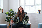 Young man with dreadlocks looking confident sitting on chair cool guy holding coffee