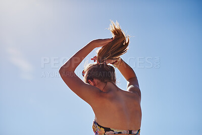 Buy stock photo Outdoor, travel and woman with hair tie for holiday, weekend break and tropical climate for space. Nature, low angle and person with ponytail for swimming preparation, summer vacation or trip in Bali