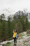 Travel adventure woman taking smart phone selfies on mountain enjoying beautiful nature landscape wanderlust