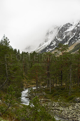 Buy stock photo Mountain, forest and snow landscape with river valley for travel, nature and outdoor adventure. Wilderness, winter season and natural environment with trees, water and woods for sustainability