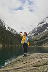 Travel adventure woman taking smart phone selfies on mountain lake enjoying beautiful nature landscape wanderlust