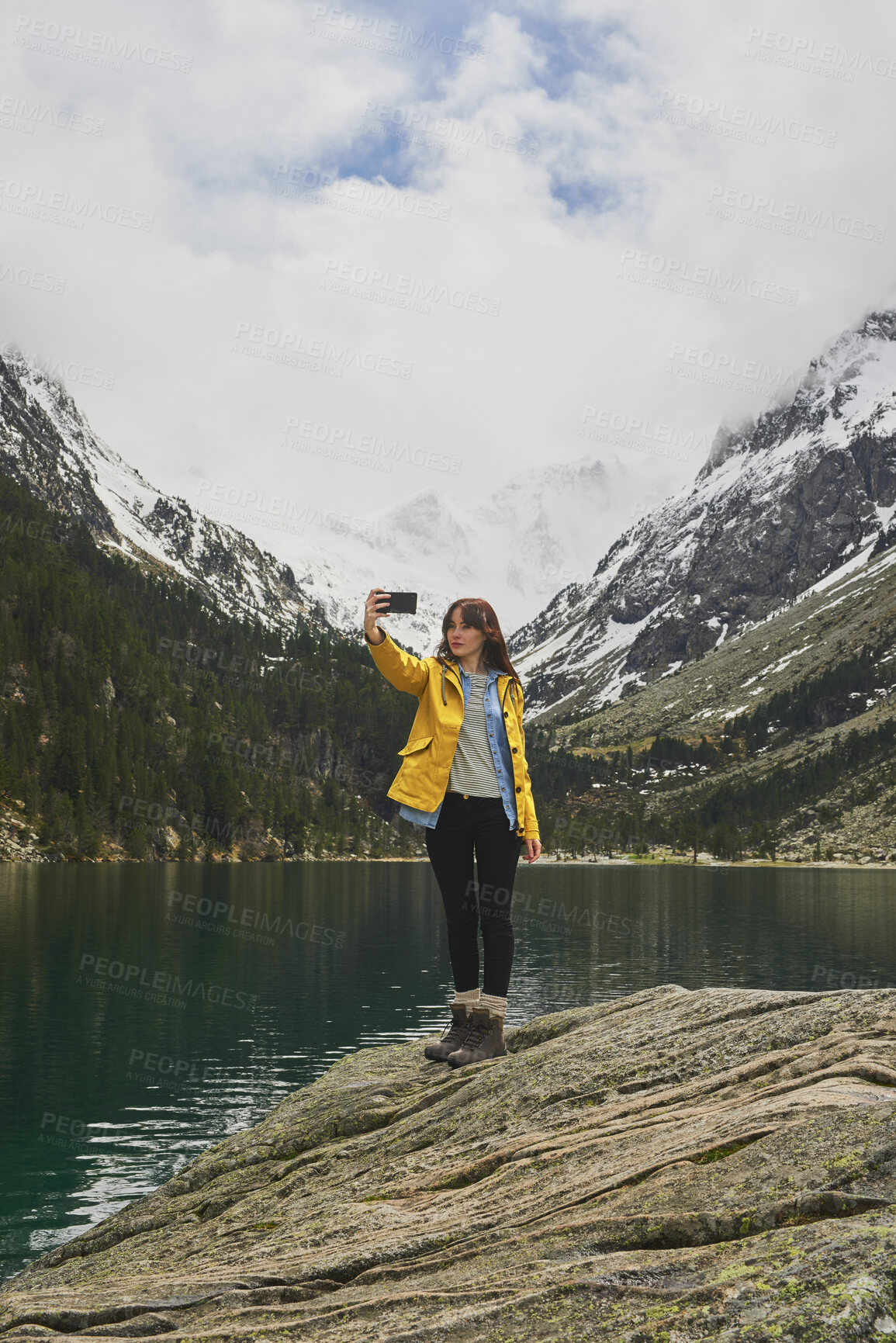 Buy stock photo Woman, selfie and lake for hiking in nature for photography, social media post and travel blog. Mountain, female person or profile picture update for trekking, adventure and memory of wilderness trip