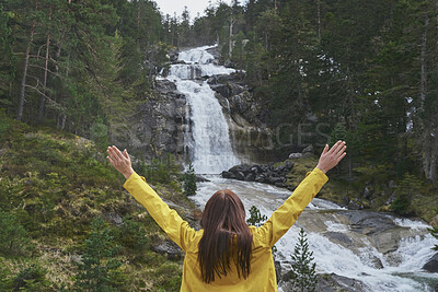 Buy stock photo Back, freedom and hiking with woman at waterfall in nature for adventure, journey or sightseeing. Arms raised, celebration and view with hiker outdoor in mountains for activity, hobby or wellness