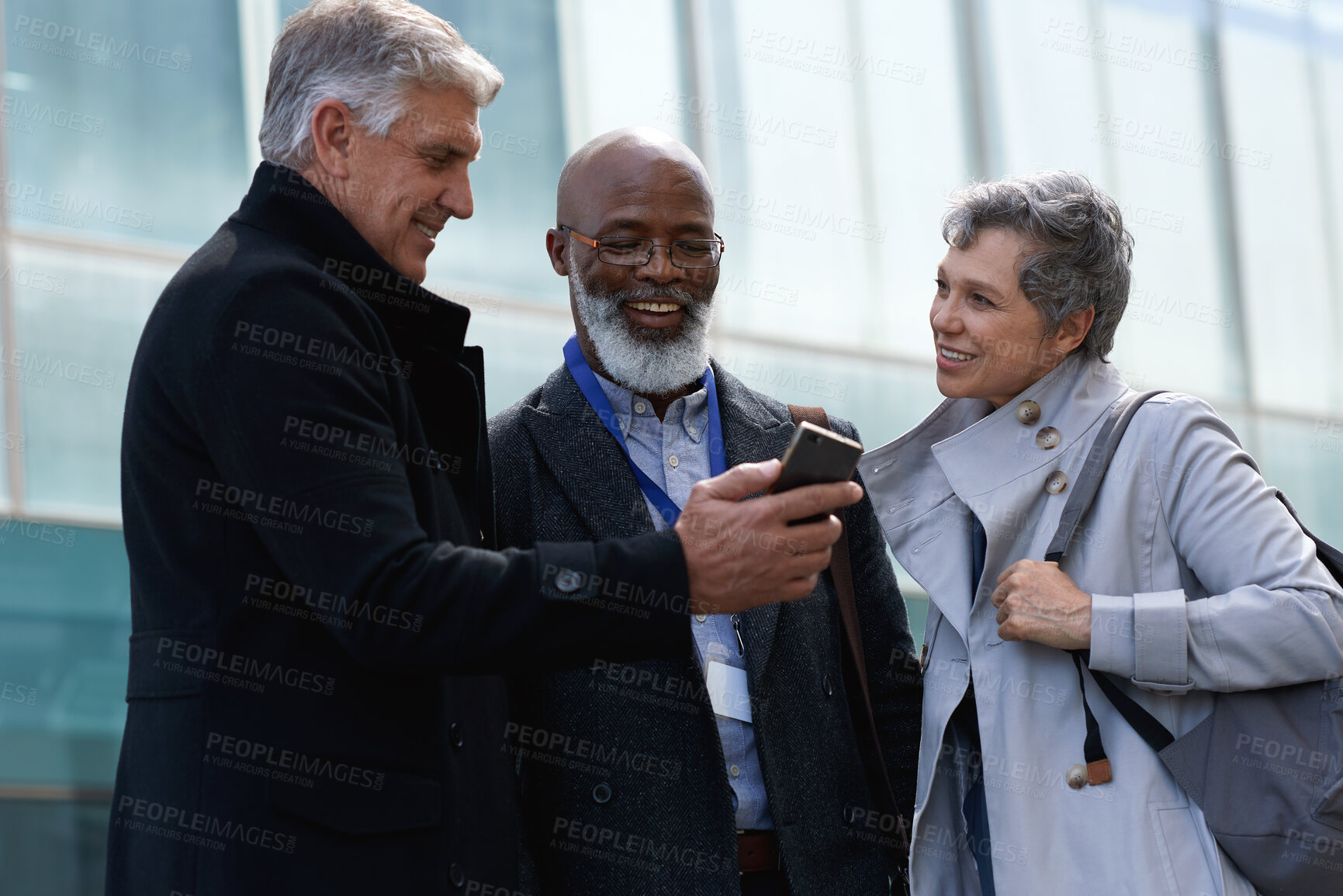 Buy stock photo Business people, mature and phone in city for online map, navigation and travel for corporate conference. Happy, networking or mobile app for commute route, colleagues and notification on work trip