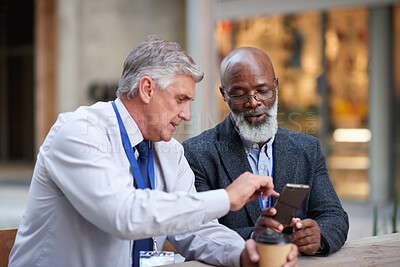 Buy stock photo City, friends and business people with phone for coffee break, check schedule and project discussion. Connection, mobile and mature men with conversation for deadline update, reading email and town