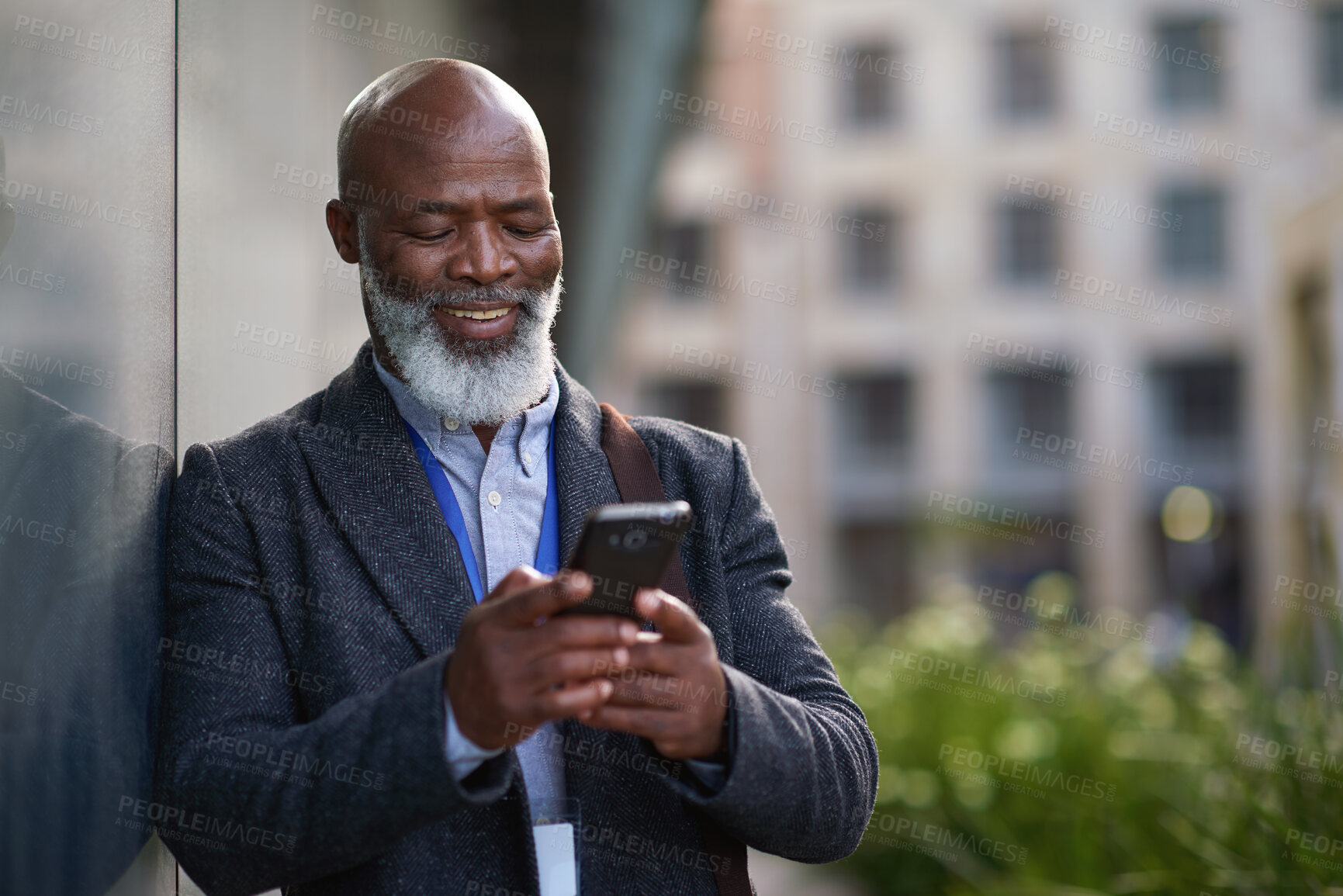 Buy stock photo Mature, cellphone and business man in city for work commute, communication and travel with smile. Black person, tech and message or typing for online contact for feedback, network or outdoor