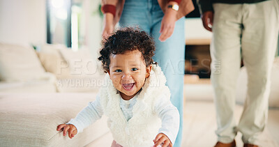 Buy stock photo Parents, walking or baby with portrait in home, child development or excited for motor skills practice. Family, infant or happy girl with learning balance in lounge, first steps or milestone support 