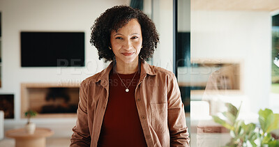 Buy stock photo Portrait, smile and African woman by window in home with good mood, confident and chill. Happy, female person and weekend in living room with positive attitude, relax and break at house in Kenya