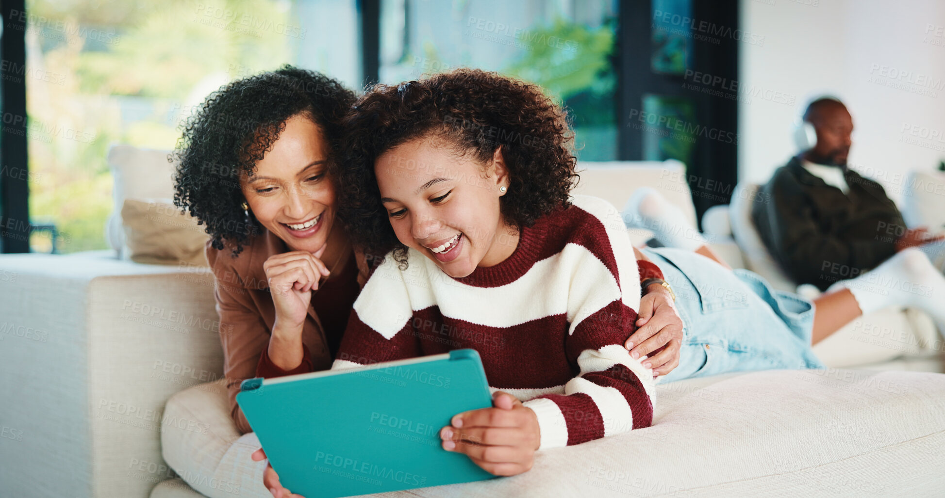 Buy stock photo Laughing, learning and tablet with family in home living room together for bonding or research. App, education and funny with parent of girl child in apartment for development, growth or schooling