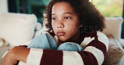 Buy stock photo Girl, child and sad in home with thinking, reflection and remember with pain or loss. Memory, negative mindset or kid with depression in living room, grief or mental wellness with trauma at house