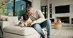 Family, father and child on tablet in living room for movies, streaming or internet show for entertainment. Dad, boy and digital tech for social media, play and app in home for weekend together