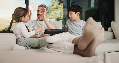 Buy stock photo Family, high five and dad with tablet in home for movies, streaming or internet show for choice. Father, children and digital tech for social media, celebration and app on sofa for weekend together