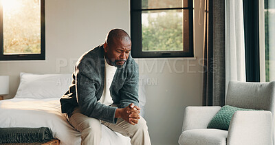 Buy stock photo Morning, sad and black man in bedroom with mental health, stress and anxiety or insomnia in house. Emotions, tension and mature person with depression and burnout, upset or grief for memories in home