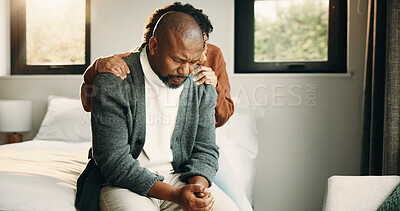 Buy stock photo Sad, couple and comfort with hug at house for empathy, grieving partner and emotional support. African people, embrace and consoling for grief, mourning loss and understanding heartbreak in bedroom