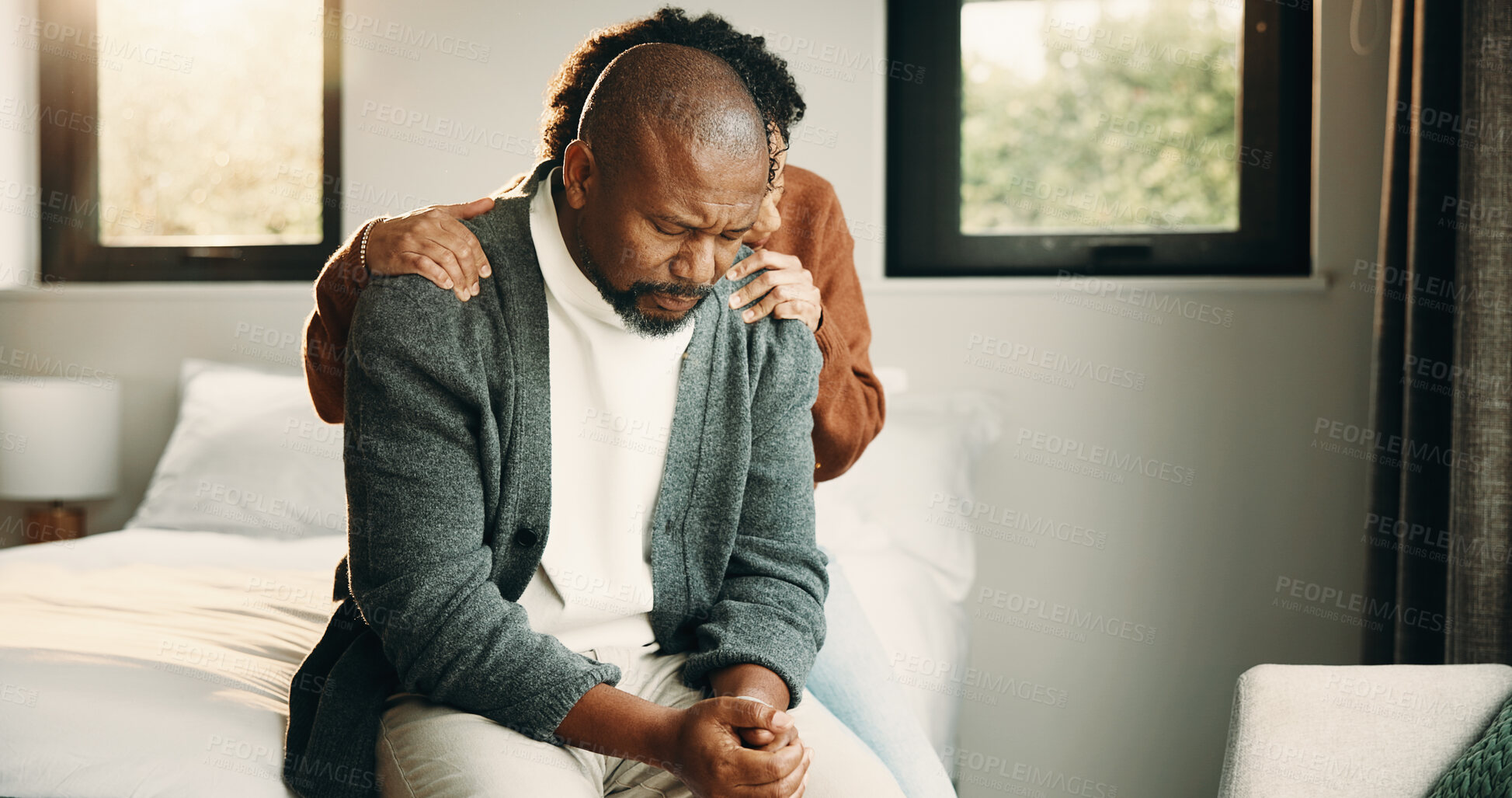 Buy stock photo Sad, couple and comfort with hug at house for empathy, grieving partner and emotional support. African people, embrace and consoling for grief, mourning loss and understanding heartbreak in bedroom