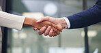 Meeting, office and handshake with business people for partnership, deal or agreement together. Employees, colleagues or shaking hands with b2b for teamwork, greeting or introduction in workplace