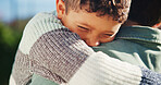Child, excited and outdoor with parent for hug, greeting and love connection with support. Care, kid and dad in nature for embrace, relationship development and trust with appreciation on fathers day