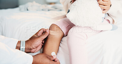 Buy stock photo Healthcare, hands and plaster for child in clinic, wellness and infection prevention after treatment. Hospital, pediatrician and person with bandage for knee pain, medical help and kid with injury
