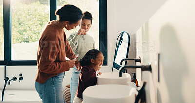 Buy stock photo Teaching, mother and children brushing teeth in bathroom, dental care or hygiene for oral wellness. Health support, morning routine and woman with girls for mouth cleaning learning or bonding in home