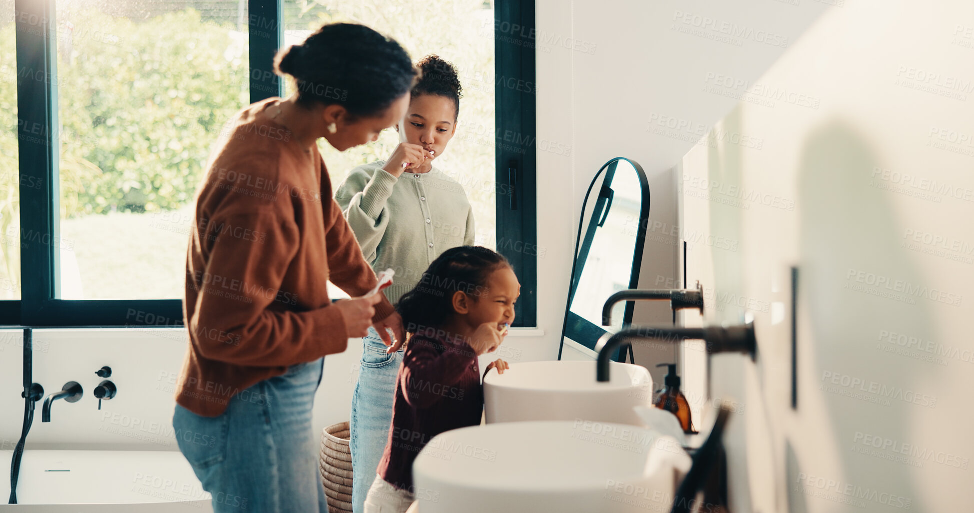 Buy stock photo Teaching, mother and children brushing teeth in bathroom, dental care or hygiene for oral wellness. Health support, morning routine and woman with girls for mouth cleaning learning or bonding in home