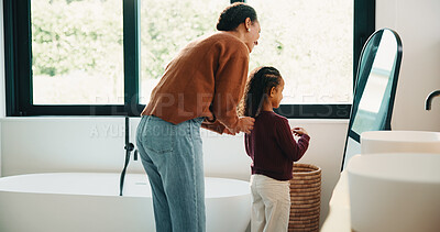 Buy stock photo Hair care, mother and child with mirror in bathroom, grooming help and morning routine for bonding. Support, love and woman with girl for getting ready, check hairstyle and happiness in family home