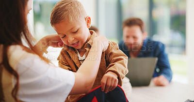 Buy stock photo Child, home and getting ready for preschool with mom, education and help son with clothes or bonding. Woman, childcare and boy with backpack for daycare, development and morning routine in house