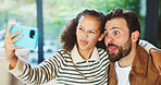 Dad, child and selfie with silly face in home for bonding, memory or capture moment together. Father, kid or hug with daughter, tongue out or funny picture for photography, comedy or humor in house